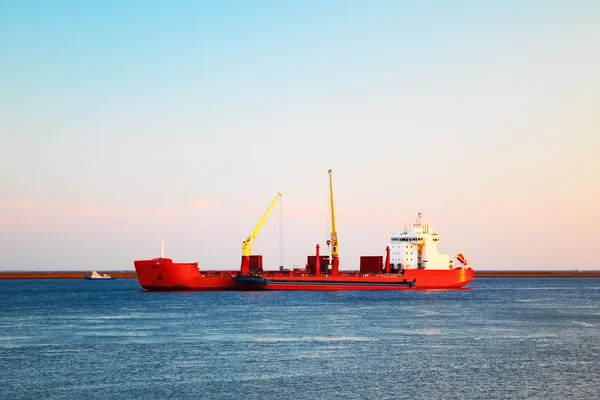 Cargo ship sailing on the river Stock Photo