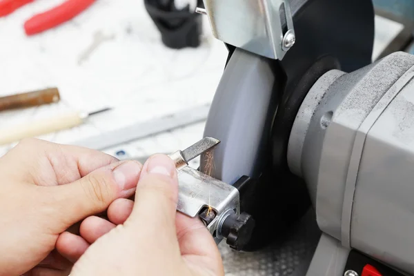 Working on the grinding machine — Stock Photo, Image