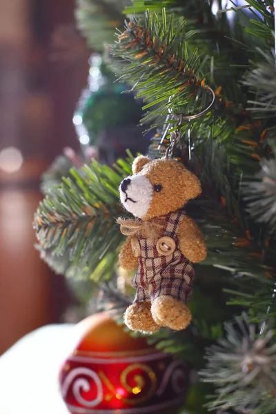 Small bear toy on the christmas tree — Stock Photo, Image