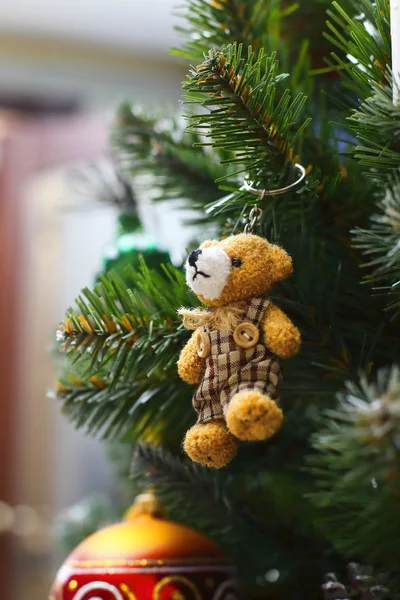 Small bear toy on the christmas tree — Stock Photo, Image