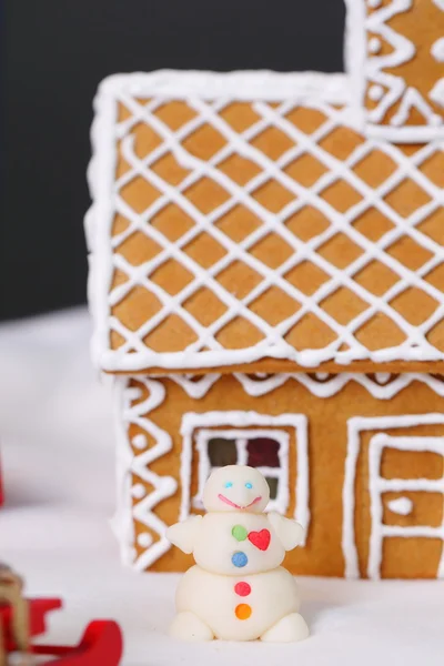 Christmas card with gingerbread house little snowman — Stock Photo, Image