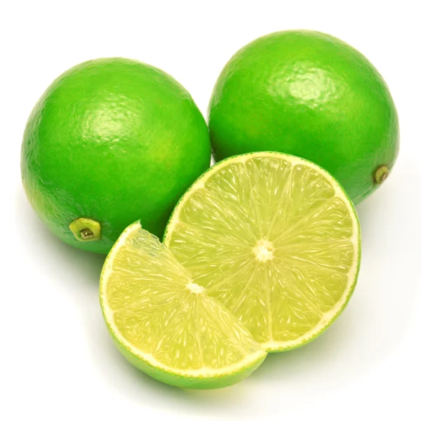 Sliced limes on white — Stock Photo, Image