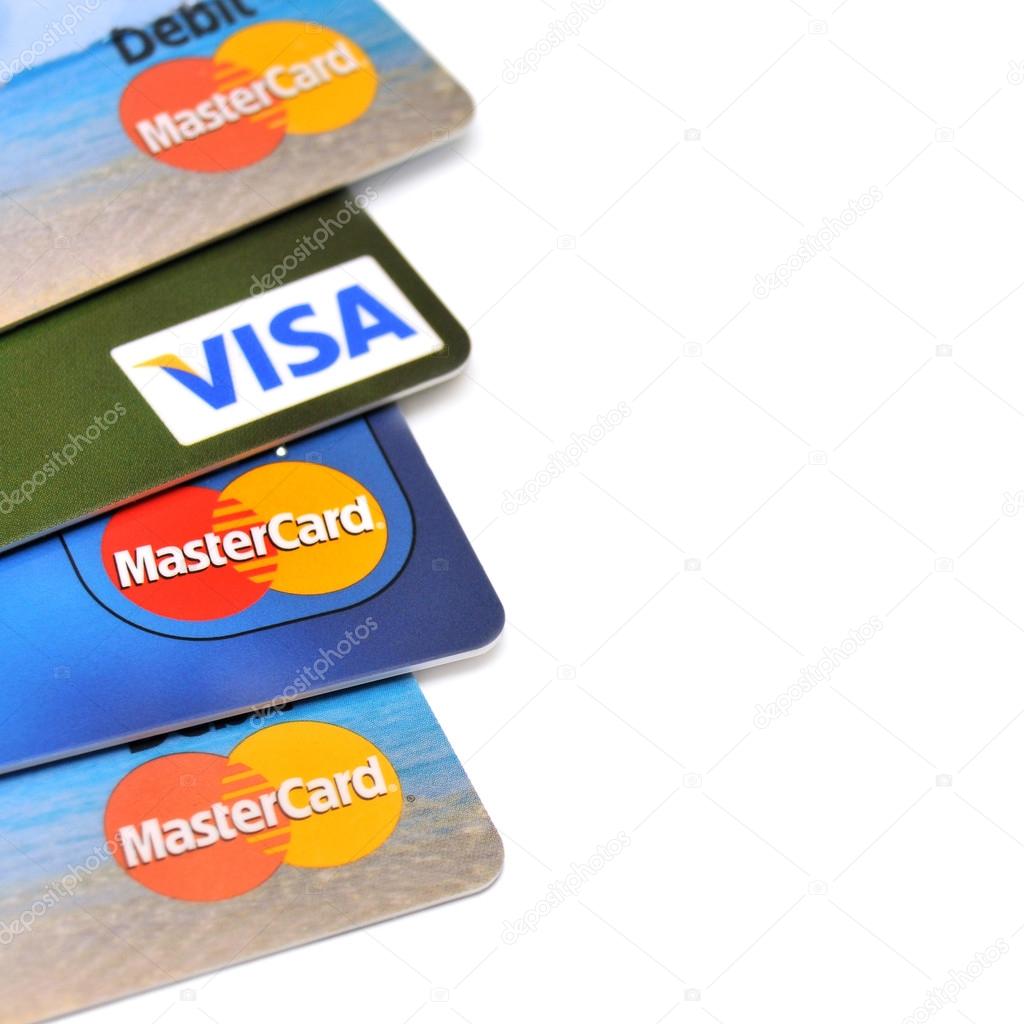 POLTAVA, UKRAINE - JANUARY 24, 2015: Photo of Visa and Mastercard credit card isolated on white background  on January 24, 2015 in Poltava, Ukraine