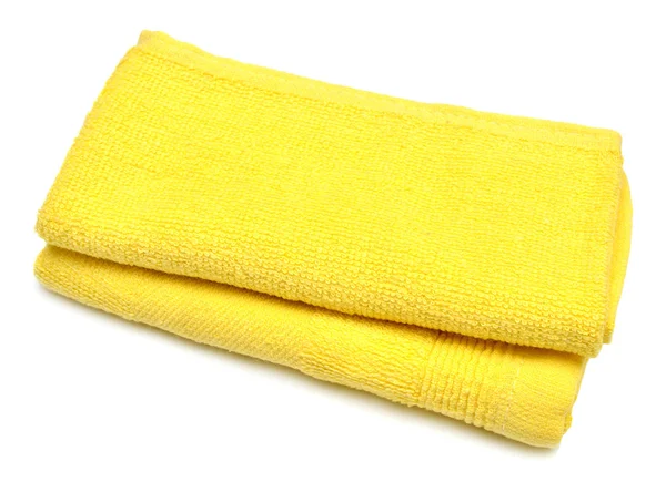 Желтое полотенце на белом — стоковое фото
