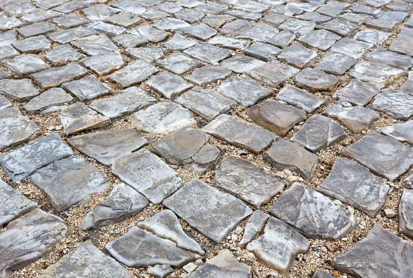 Cobbled road as background. — Stock Photo, Image