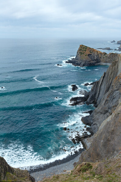 Summer Atlantic ocean rocky coastline (Algarve, Portugal).