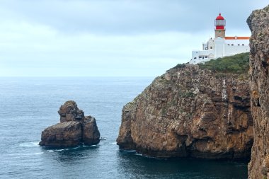 Lighthouse on cliff (Algarve, Portugal). clipart