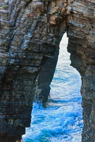Natural arches on beach. — Stock Photo, Image