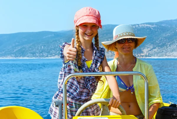 Mother with daughter in a motorboat. — Stock Photo, Image