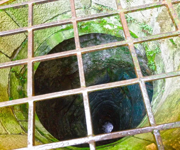 Old well with iron grate — Stock Photo, Image