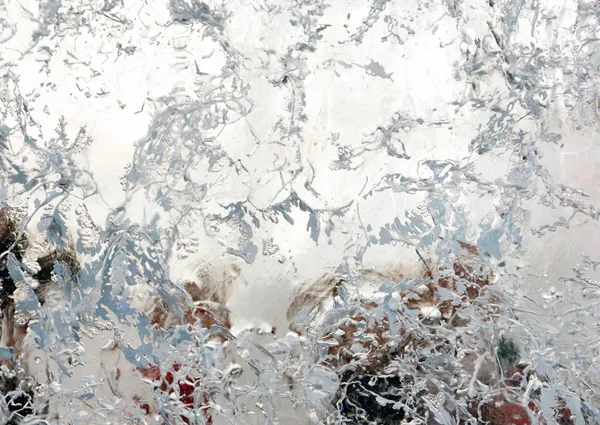 Glacial transparent block of ice with patterns.