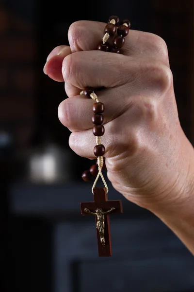 Rosary beads in hand — Stock Photo, Image