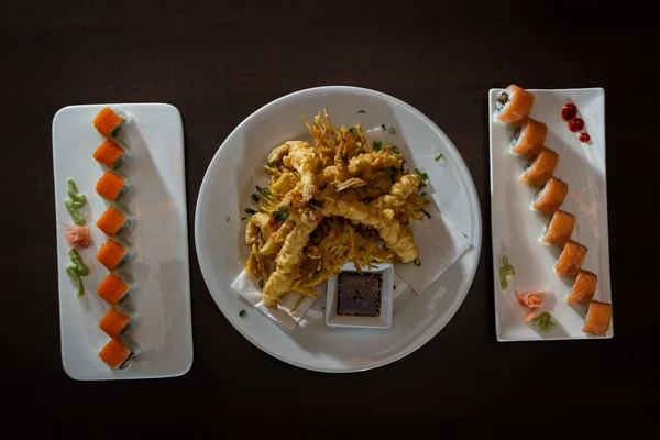 Freshly prepared sushi dish and tempura shrimp — Stock Photo, Image