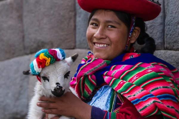 Native Peruvian holding a baby lamb — Stock Photo, Image
