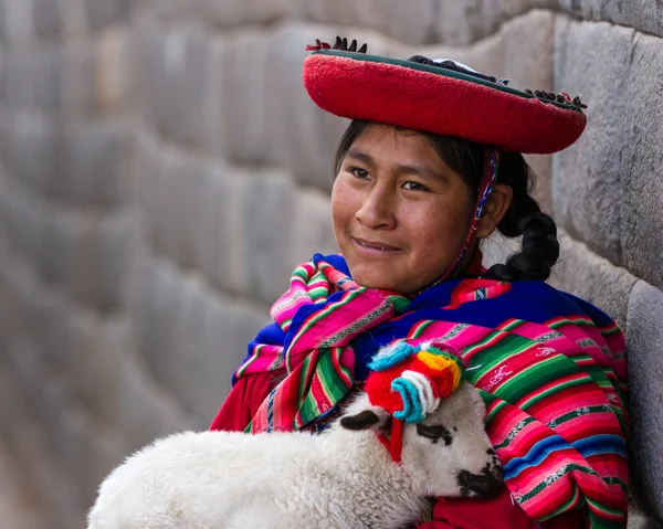 Native Peruvian holding a baby lamb — Stock Photo, Image