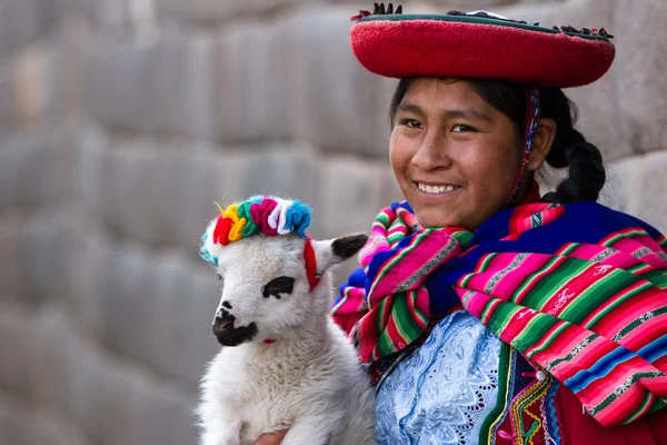 Native Peruvian holding a baby lamb — Stock Photo, Image