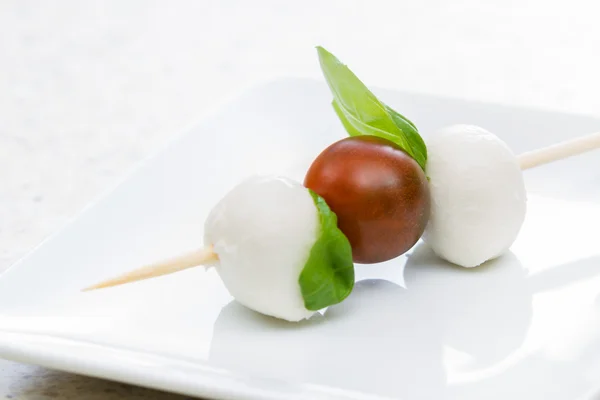 Fresh mozzarella and tomato appetizer — Stock Photo, Image