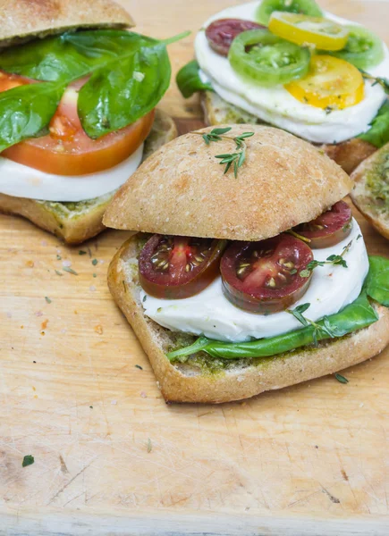 Fresh mozzarella tomato sandwiches with basil — Stock Photo, Image