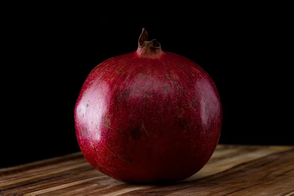 Whole organic pomegranate — Stock Photo, Image