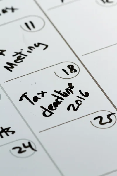 Dia de imposto em um calendário — Fotografia de Stock