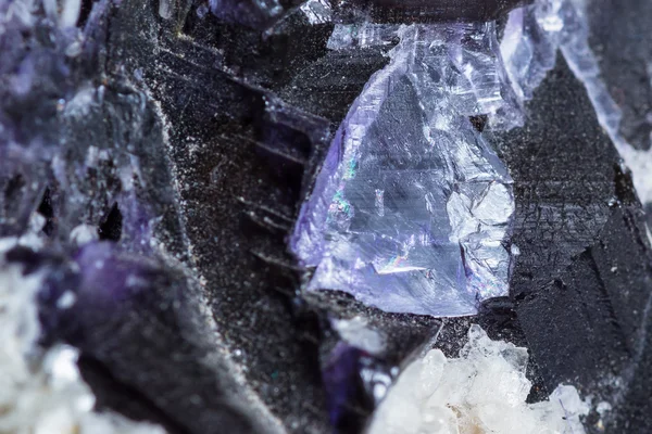 Crystals growing in golds and purple — Stock Photo, Image