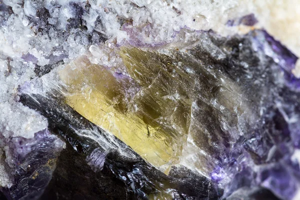 Crystals growing in golds and purple — Stock Photo, Image