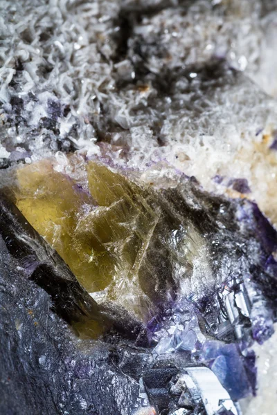 Crystals growing in golds and purple — Stock Photo, Image