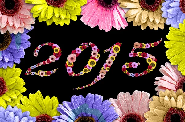 2015 Flores en ramé hechas de margaritas de colores sobre fondo de madera —  Fotos de Stock