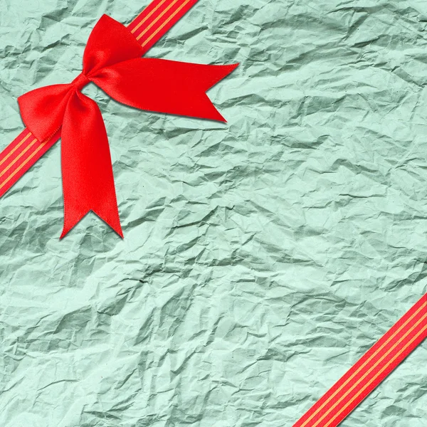 Red ribbon with corner bow — Stock Photo, Image