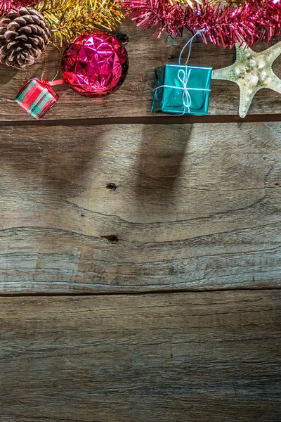 Top view of  Christmas garland on rustic wooden background with copy space — Stock Photo, Image