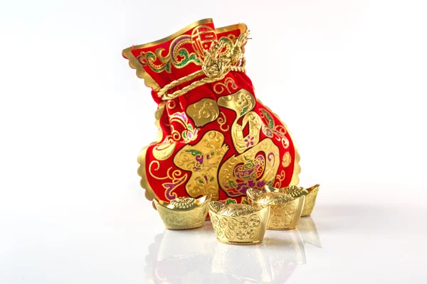 Red Gift Bags and Gold Ingots on White — Stock Photo, Image