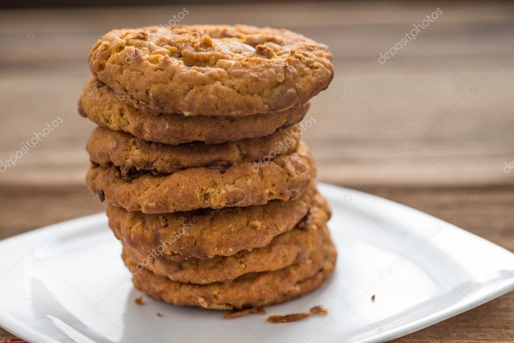 Stacked chocolate chip cookies  on wooden table