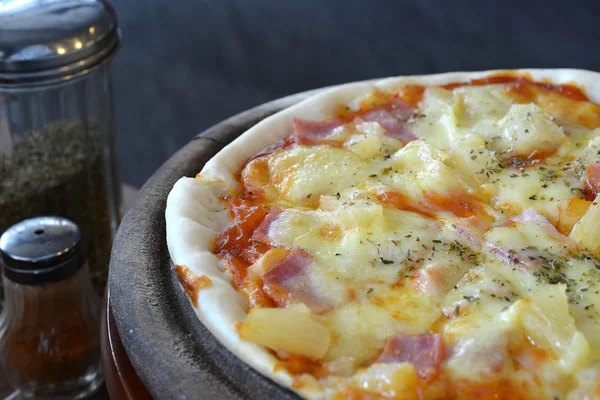 hawaiian Pizza , pineapple , ham and cheese on wooden tray