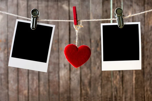 Two blank instant photos hanging on the clothesline — Stock Photo, Image