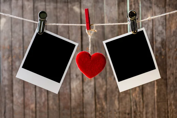 Two blank instant photos hanging on the clothesline — Stock Photo, Image