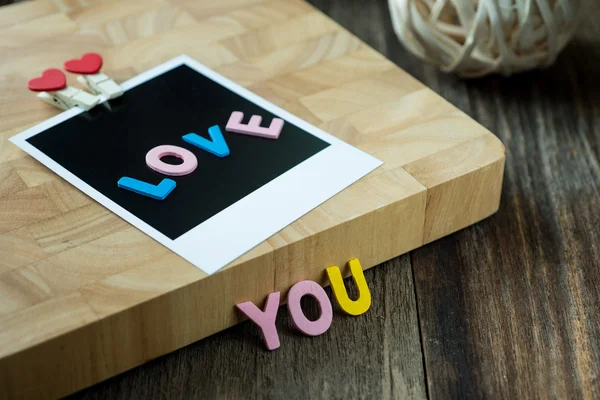 Love you message on Blank instant photo — Stock Photo, Image