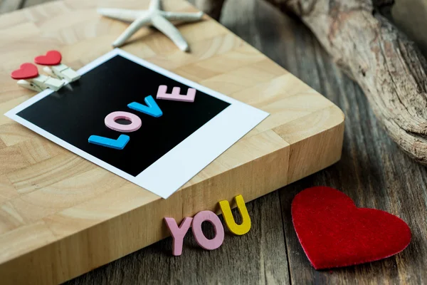 Love you message on Blank instant photo — Stock Photo, Image