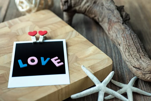 Mensagem de amor na foto instantânea em branco — Fotografia de Stock