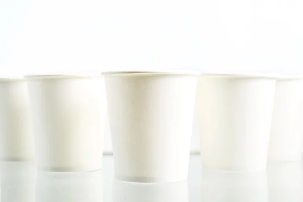 Disposable paper cups on white background — Stock Photo, Image