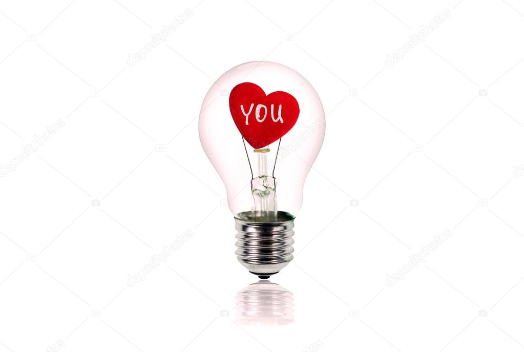 The Red Heart inside of the light bulb isolated on white.