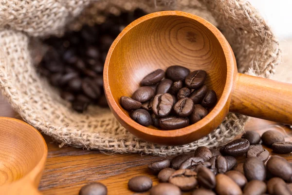 Coffee beans in coffee bag made from burlap — Stock Photo, Image