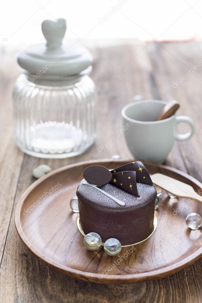  Dark chocolate cake on wooden background