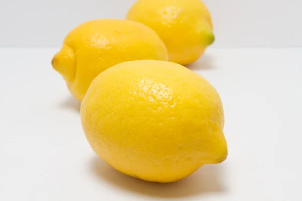 Whole lemons on a white background — Stock Photo, Image