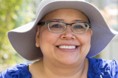 Cancer Patient Wears Hat For Sun Protection clipart