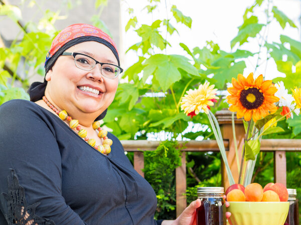 Hispanic Female With Bright Smile Dining Outdoors