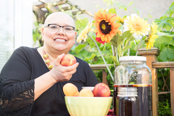 Hispanic Female Holding Fruit In Hand