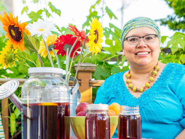 Hispanic Female With Bright Smile Dining Outdoors