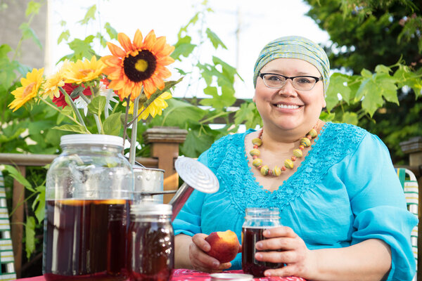 Female Holds Fruit And Mason Jar