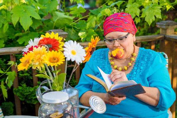 Hispanic Woman Enjoys Evening Snack Outside