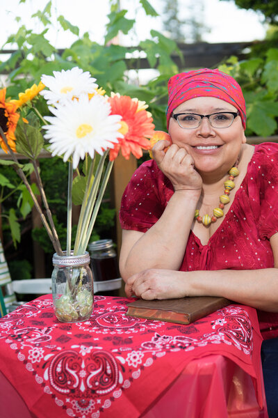 Woman With Beautiful Smile Seated Outdoors